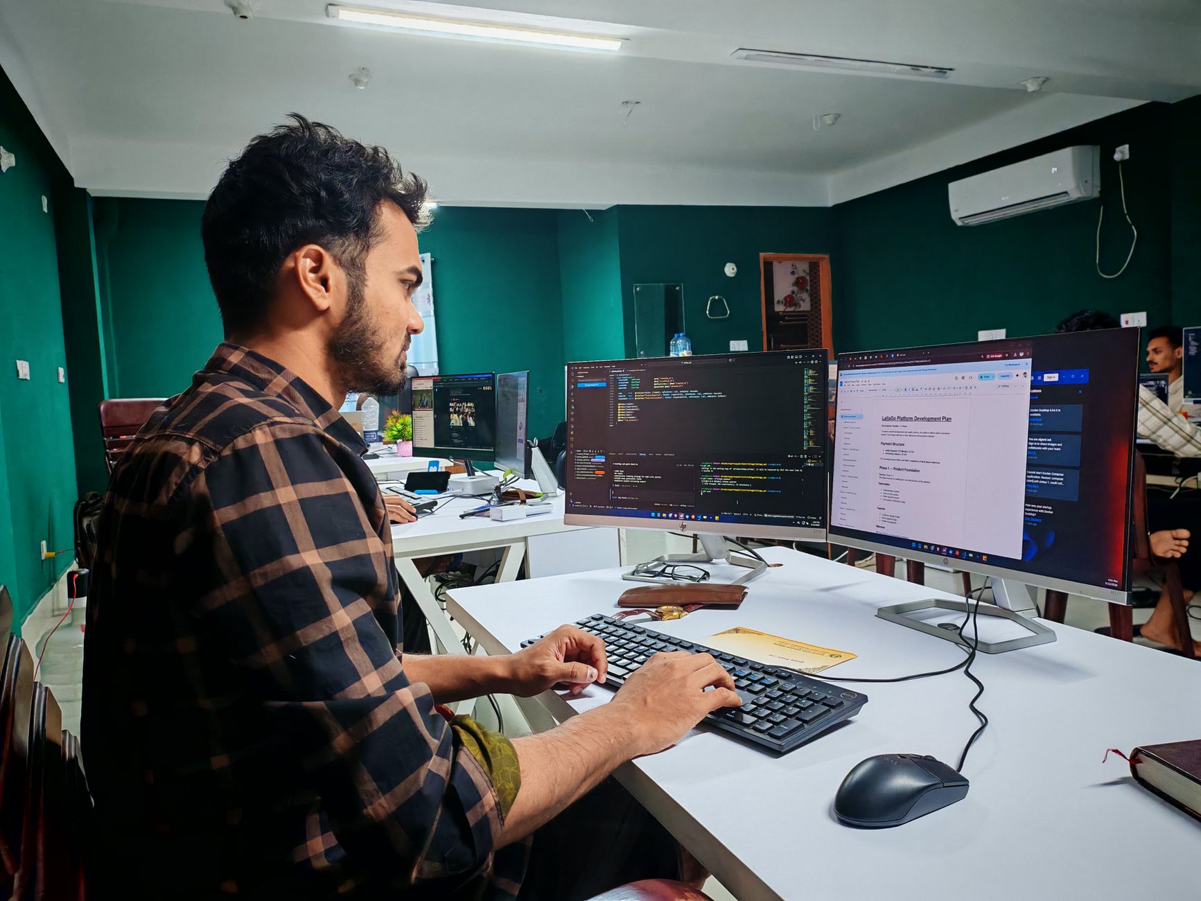 Indian modern workspace with desks and screens